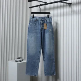 Levi’S X Nike Loose Fitting Jeans With Ribbed Trim Snap Buttons And Lettering Patch