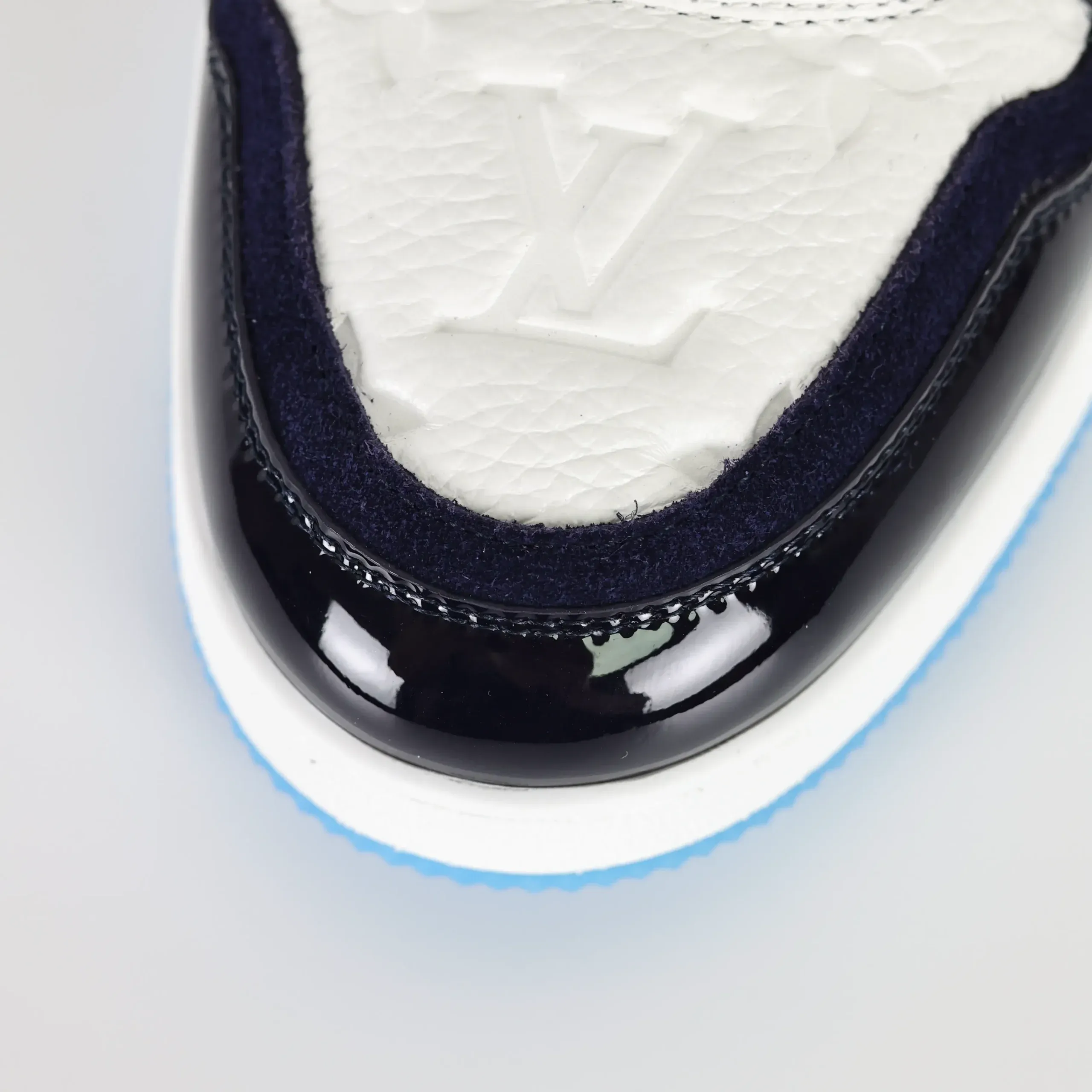 Trainer Monogram Sneakers In White Grained Calfskin And Black And Blue Patent Leather - Image 10