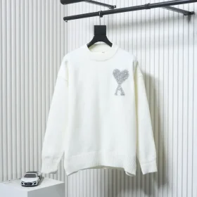 AMI Sweater In A Minimalist French Style With A Round Neckline And A Silver Heart Logo