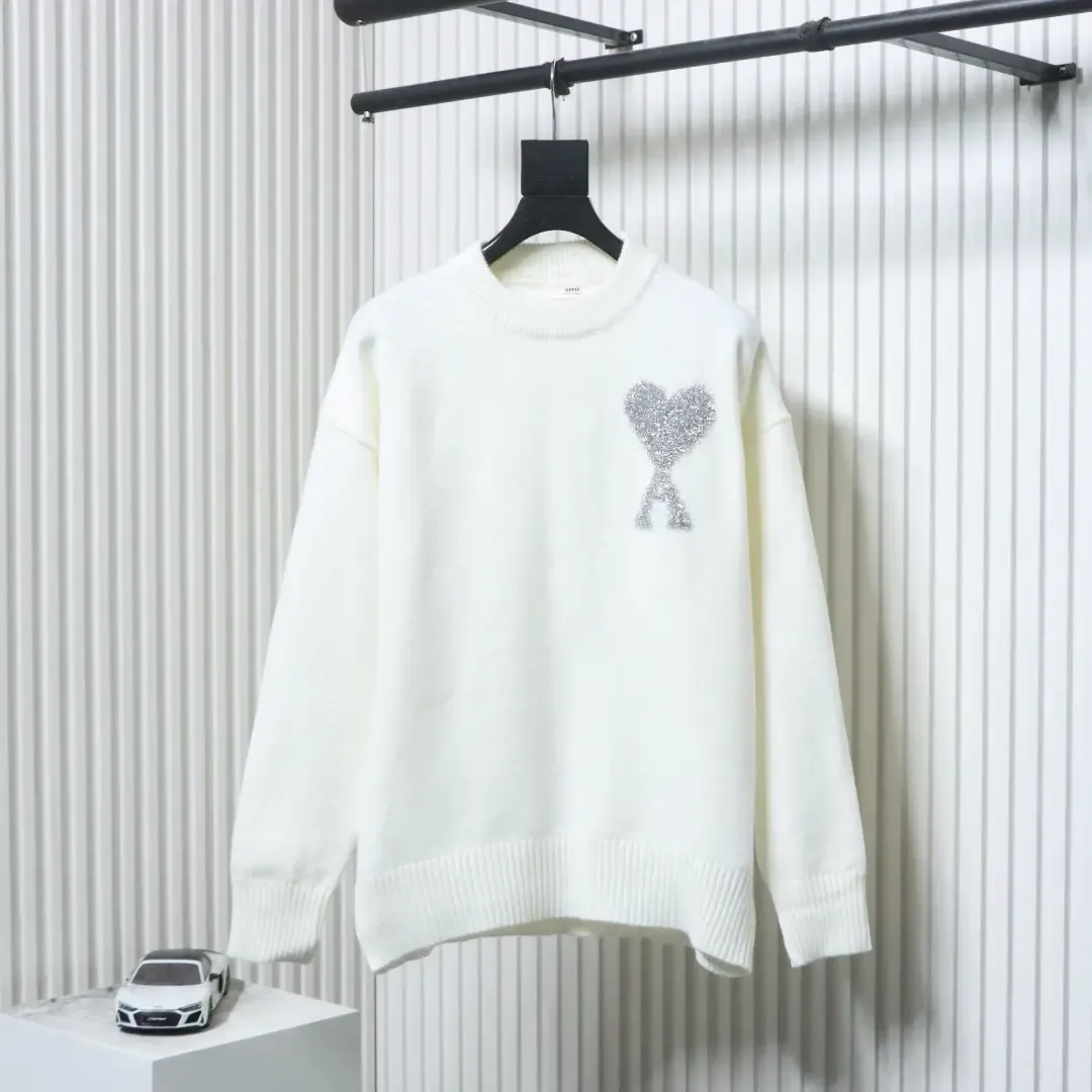AMI Sweater In A Minimalist French Style With A Round Neckline And A Silver Heart Logo