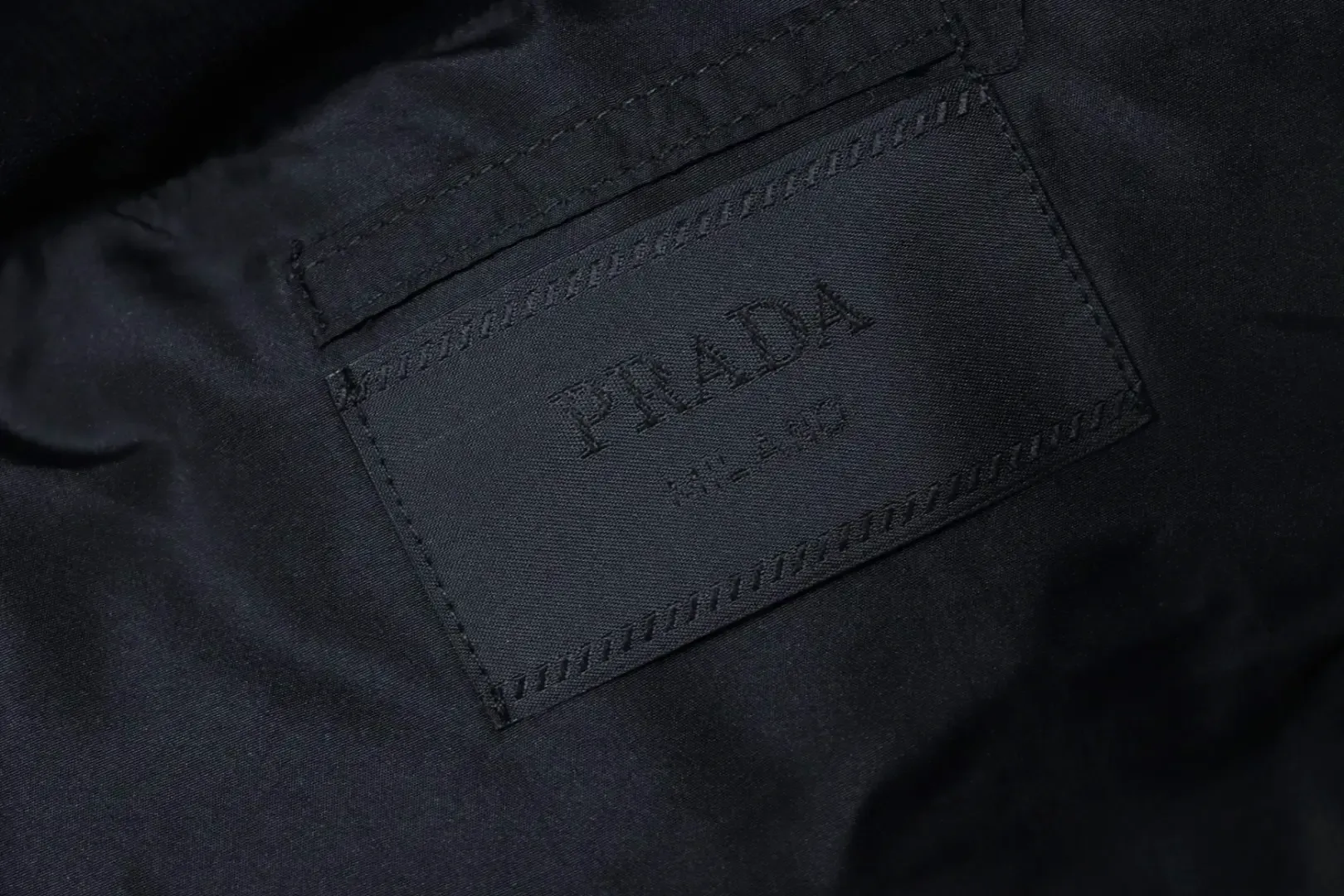 New Down Jacket With A Detachable Triangular Logo - Image 8