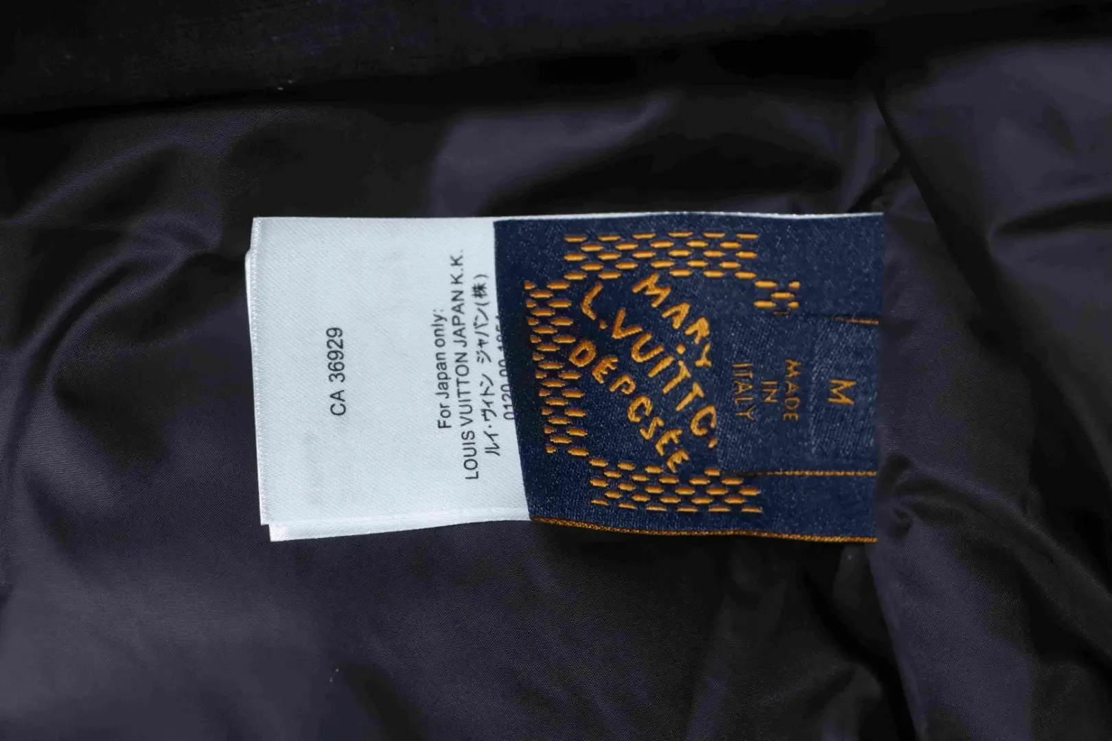 Trench Coat With Monogram Embossing And Cargo Pockets, And A Down Jacket With A Zipper - Image 11