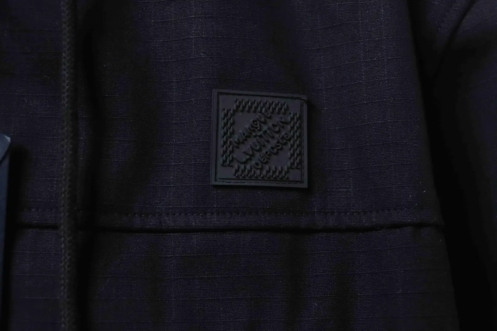 Trench Coat With Monogram Embossing And Cargo Pockets, And A Down Jacket With A Zipper - Image 8