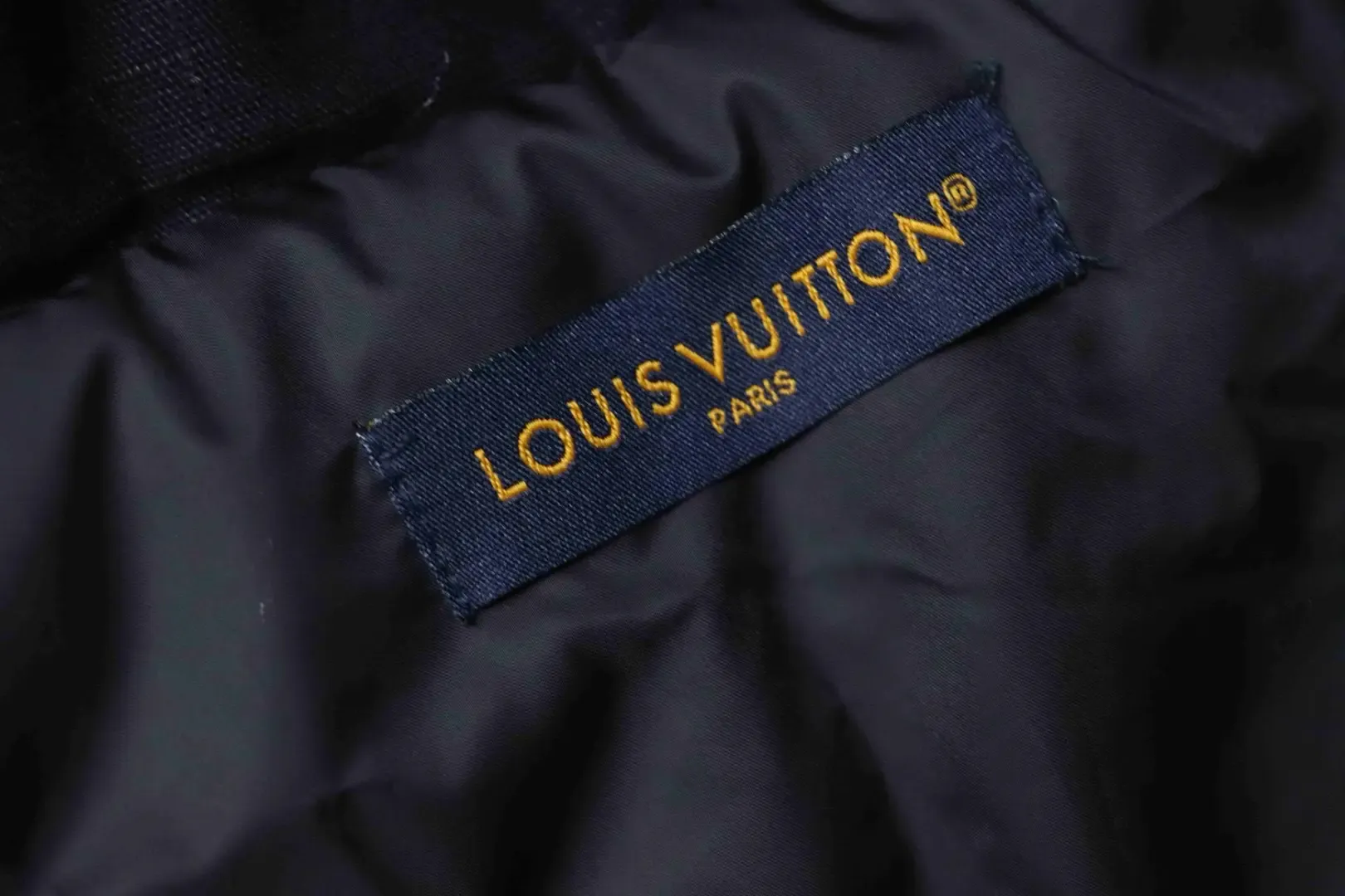 Trench Coat With Monogram Embossing And Cargo Pockets, And A Down Jacket With A Zipper - Image 9